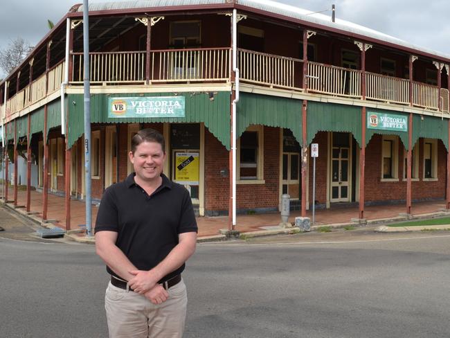 Troy Townsend stands in front of Townsville's Republic Hotel which is under contract for sale.