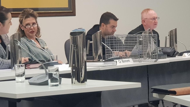 Councillor Therese Britton-La Salle with a cat trap she displayed at a Campbelltown Council meeting in 2019. Picture: Colin James