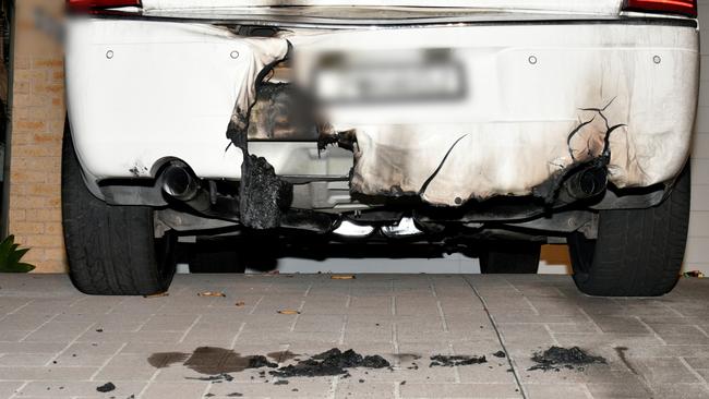 The Chrysler sedan belonging to the former Comanchero was damaged when at least two bombs were placed underneath it at Rutherford on October 27, 2022. Picture: NSW Police.