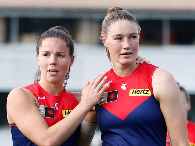 MELBOURNE, AUSTRALIA - NOVEMBER 12: Kate Hore (left) and Tayla Harris of the Demons look dejected after a loss during the 2023 AFLW Second Qualifying Final match between The Melbourne Demons and The North Melbourne Tasmanian Kangaroos at IKON Park on November 12, 2023 in Melbourne, Australia. (Photo by Michael Willson/AFL Photos via Getty Images)