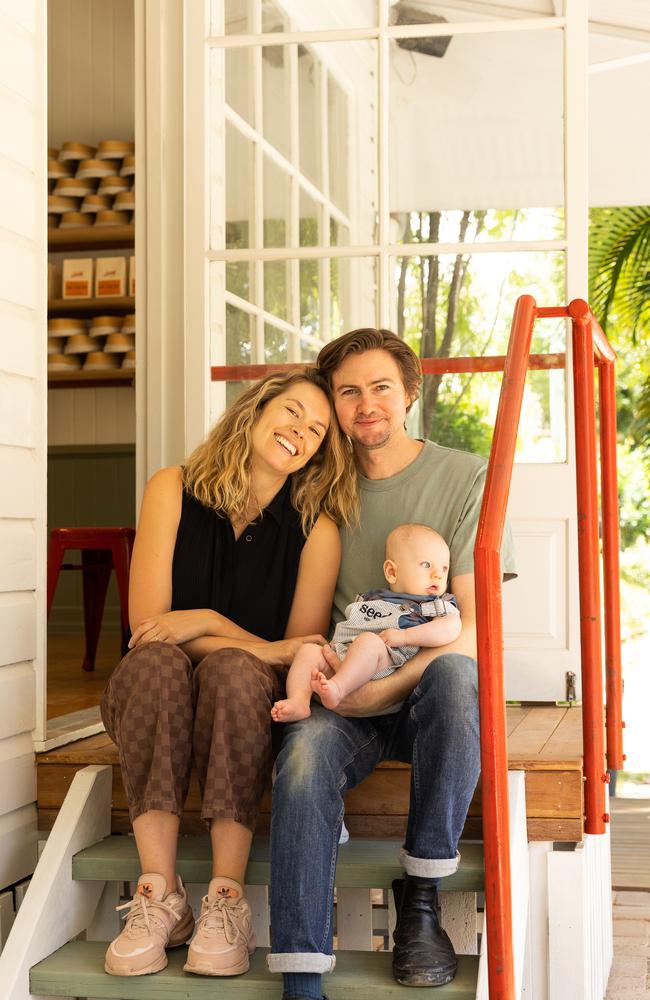 Amy Lehpamer and Tom Cooney with their child.