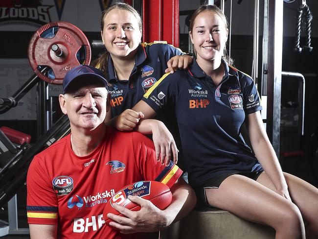 AFLW - Former Crows player and West Adelaide Coach Mark Mickan back with the crows as AFLW ruck coach - with West Adelaide players and Crows players Chelsea Biddle and Madison Newman at the Westies clubrooms. Picture SARAH REED