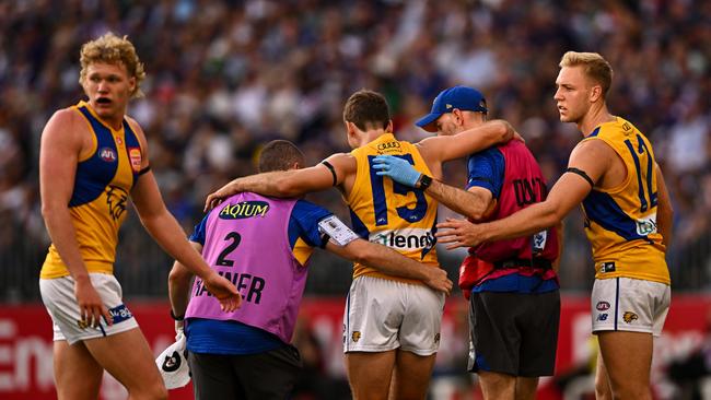 Jamie Cripps helped off the field. Photo by Daniel Carson/AFL Photos via Getty Images