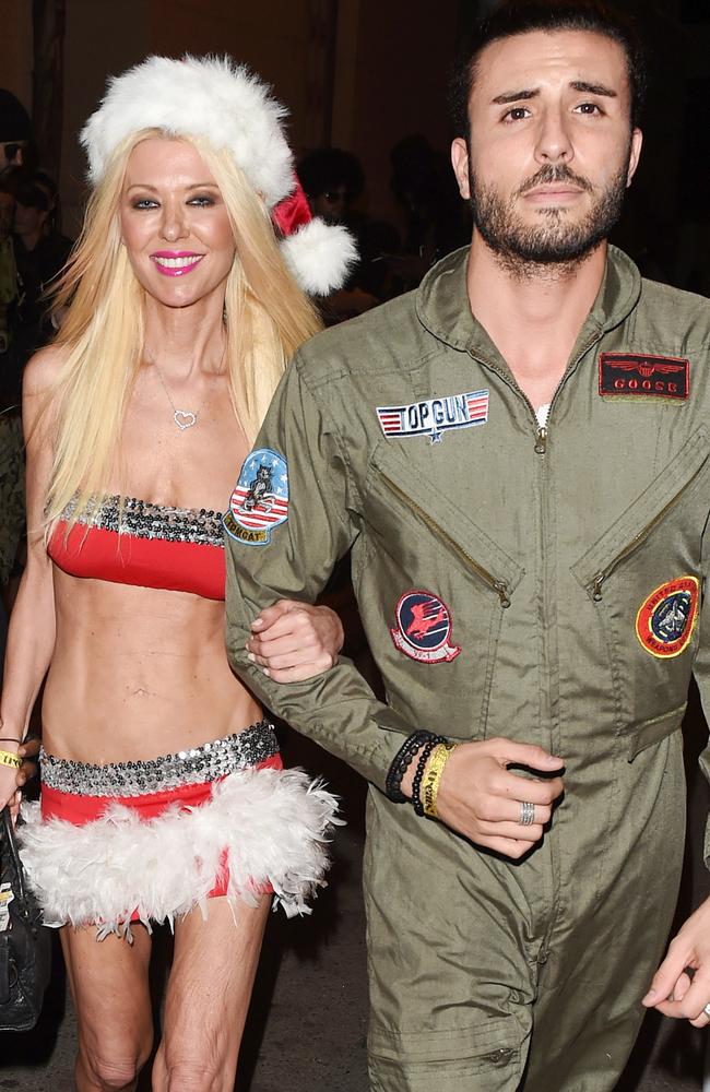 Tara and her date left arm in arm at the Treats magazine Halloween bash. Picture: Splash News Australia