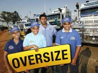 With their family trucking company’s Mactrans trucks are (from left) Huzaifah Ali, Farhan Deen, Ifran (rear) and Faadhil Deen, all of Forest Lake.