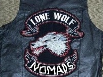 Leather jacket with Lone Wolf bikie gang logo patch on the back.