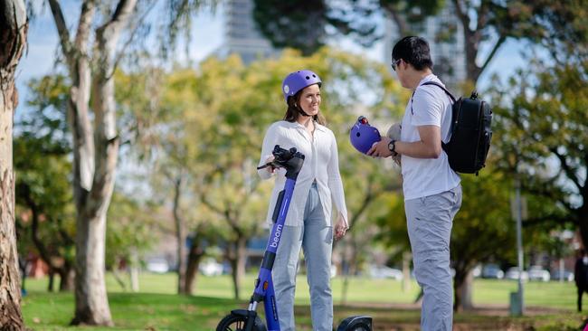 Two Darwin Beam e-scooter users during their rollout in 2023. Picture: City of Darwin / Nat Rogers