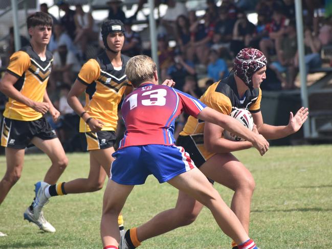 Hugh McKinlay makes one of his powerful runs against Darling Downs. Photo: Pam McKay