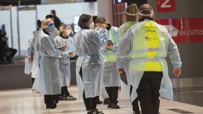 Health workers were at Melbourne Airport on Saturday greeting arrivals from Queensland. Picture: Rob Leeson