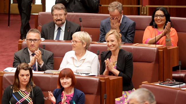 Crossbench senators celebrate as the medivac bill is passed yesterday. 