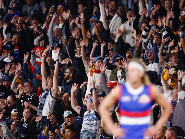 The crowd perform a Mexican wave on Saturday night. Picture: Michael Willson/AFL Photos