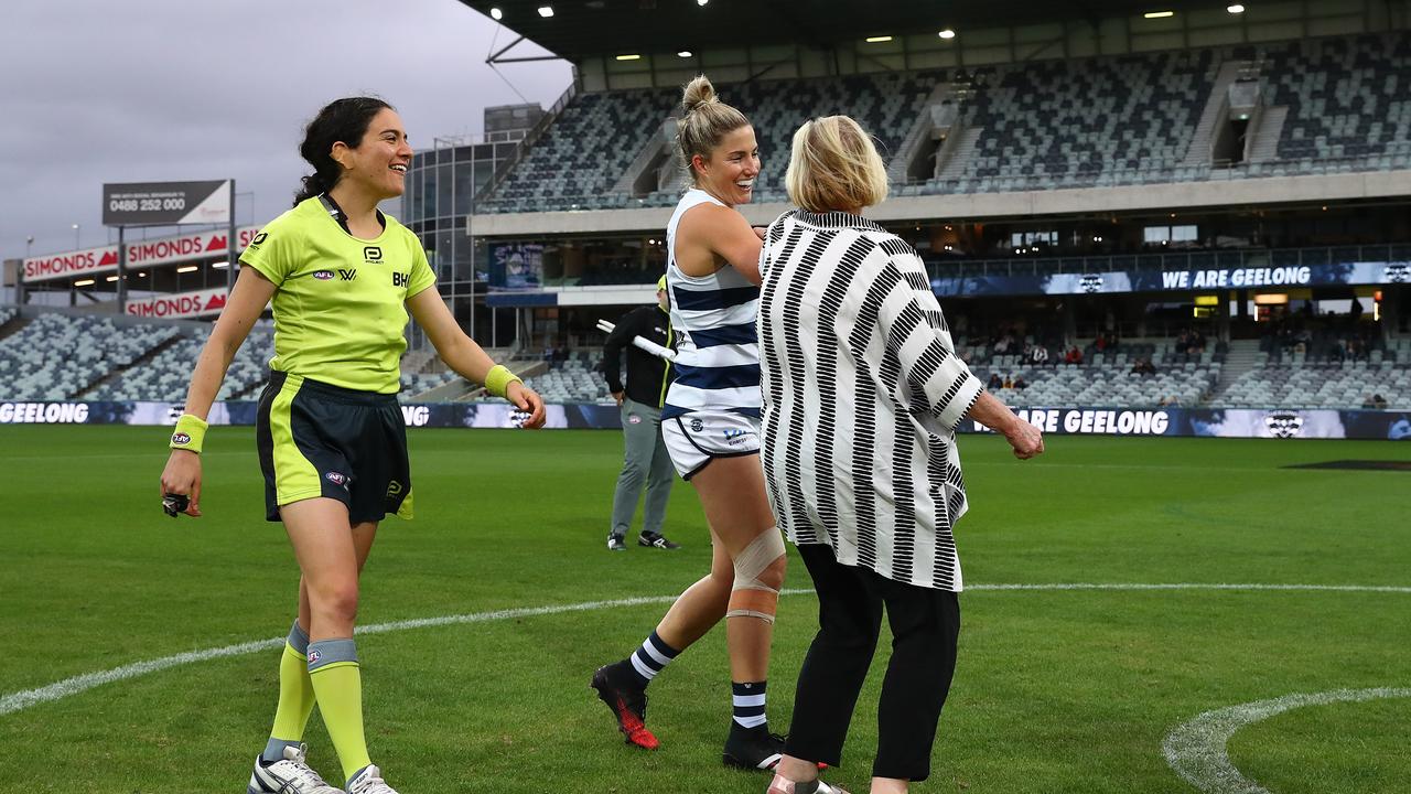 Players use an elbow bump instead of a handshake during the AFLW match between the Geelong Cats and the North Melbourne Kangaroos. Picture: Kelly Defina/Getty