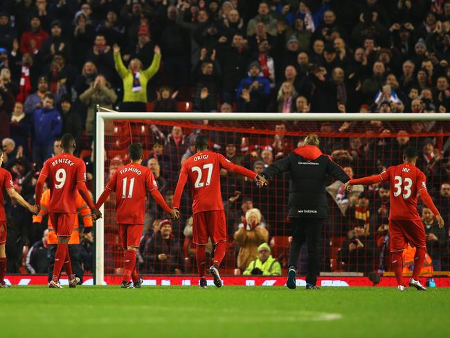 LIVERPOOL, ENGLAND - DECEMBER 13: Jurgen Klopp, manager of Liverpool and player salute The Kop after the Barclays Premier League match between Liverpool and West Bromwich Albion at Anfield on December 13, 2015 in Liverpool, England. (Photo by Alex Livesey/Getty Images)