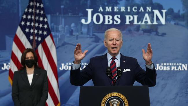 Joe Biden flanked by Vice-President Kamala Harris in Washington on Thursday. Picture: AFP