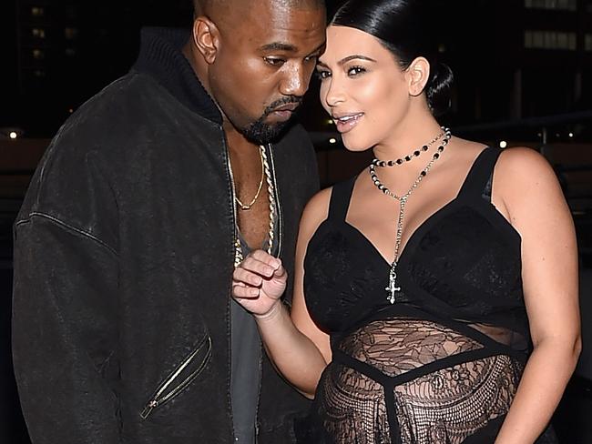 NEW YORK, NY - SEPTEMBER 11: Rapper Kanye West (L) and television personality Kim Kardashian attend the Givenchy fashion show during Spring 2016 New York Fashion Week at Pier 26 at Hudson River Park on September 11, 2015 in New York City. (Photo by Michael Loccisano/Getty Images)