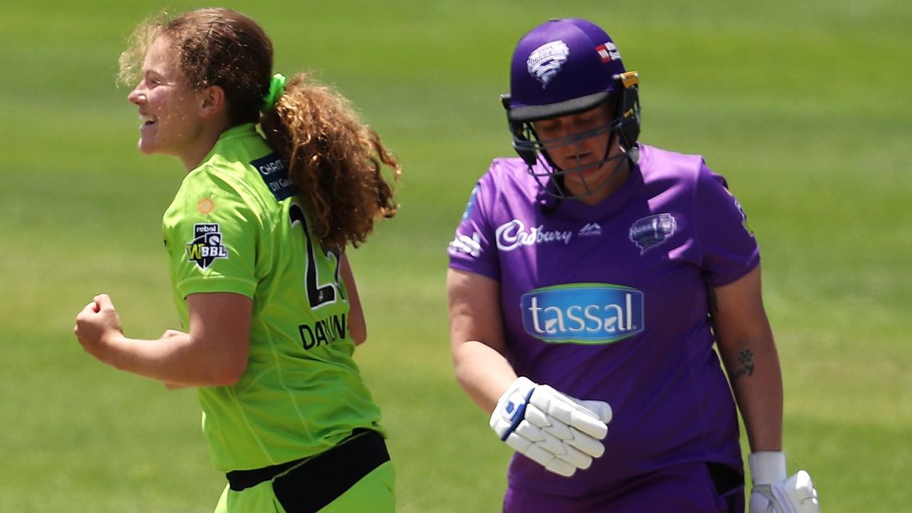 Thunder bowler Hannah Darlington celebrates victory as Rachel Priest of the Hurricanes looks dejected at the defeat. Picture: Mark Kolbe/Getty Images