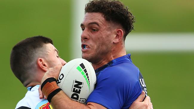 SYDNEY, AUSTRALIA - FEBRUARY 27: Adam Elliott of the Bulldogs is tackled during the NRL Trial Match between the Cronulla Sharks and the Canterbury Bulldogs at Netstrata Jubilee Stadium on February 27, 2021 in Sydney, Australia. (Photo by Matt Blyth/Getty Images)