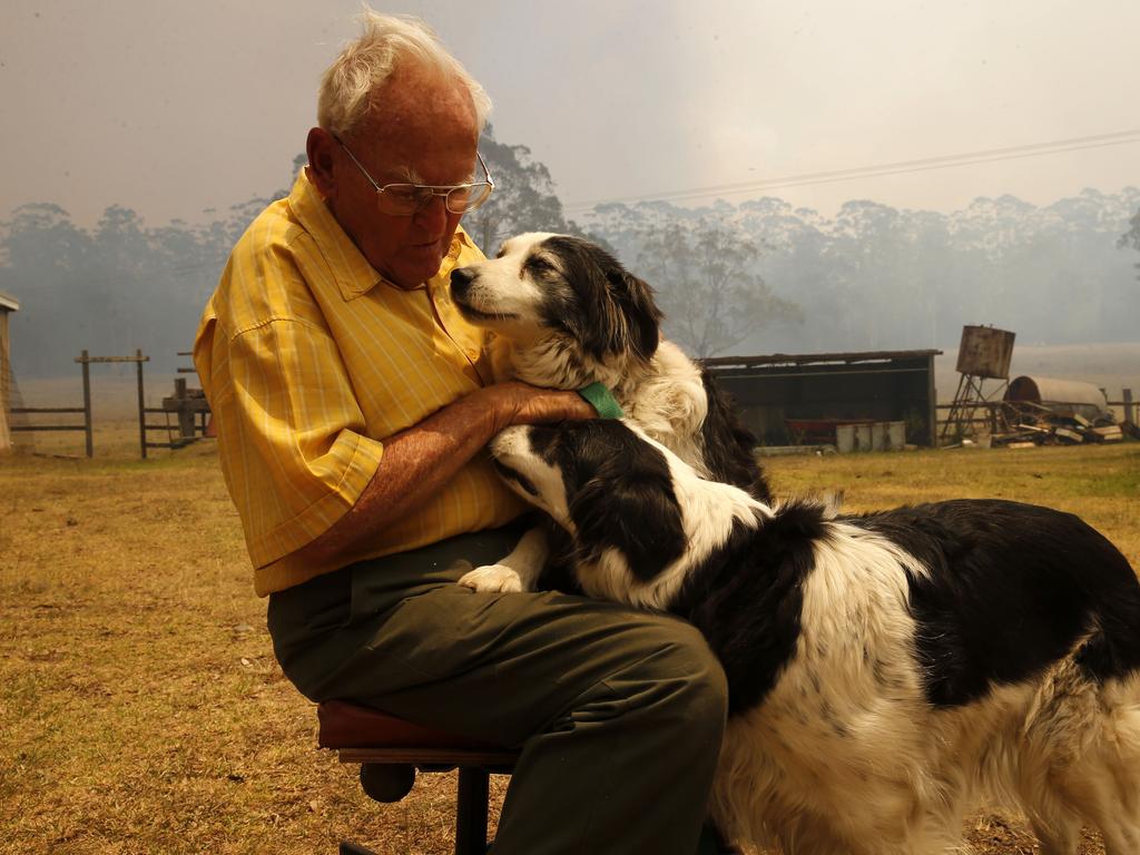 Taree resident Owen Whalan, who was comforted by Prime Minister Scott Morrison on Sunday, was forced to again evacuate his home just hours after returning this morning. Picture: AAP