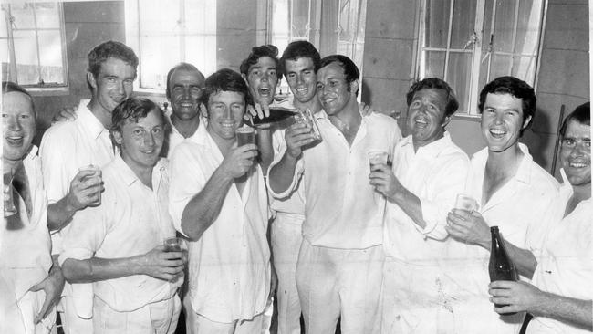 The SA cricket team celebrates after its outright victory over NSW at Adelaide Oval clinched the Sheffield Shield, 01 Mar 1971. In the dressing room are (l-r) Kevin McCarthy, Ashley Mallett, Mike Hendricks, John Causby, Ian Chappell, Jeff Hammond, Greg Chappell, Eric Freeman, Ken "K.G." Cunningham, Ashley Woodcock and Terry Jenner. (Pic by unidentified staff photographer)