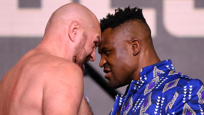 RIYADH, SAUDI ARABIA - OCTOBER 26: Tyson Fury and Francis Ngannou face off during a press conference ahead of the Tyson Fury v Francis Ngannou boxing match at Boulevard Hall on October 26, 2023 in Riyadh, Saudi Arabia. (Photo by Justin Setterfield/Getty Images)