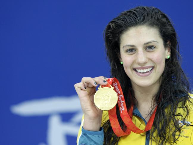 Swimmer Stephanie Rice of Australia smiles as she shows off her gold medal following the awards ceremony of the women's 400 individual medley in the National Aquatics Centre, also known as the 'Water Cube' at the 2008 Beijing Olympic Games in Beijing, China 10/08/2008.