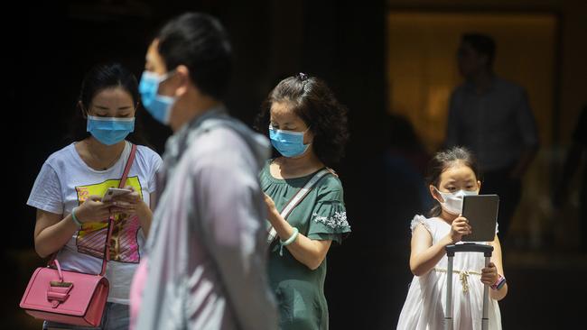 People in Sydney's CBD pictured wearing masks after the World Health Organisation declared the coronavirus a global health emergency. Picture: Getty