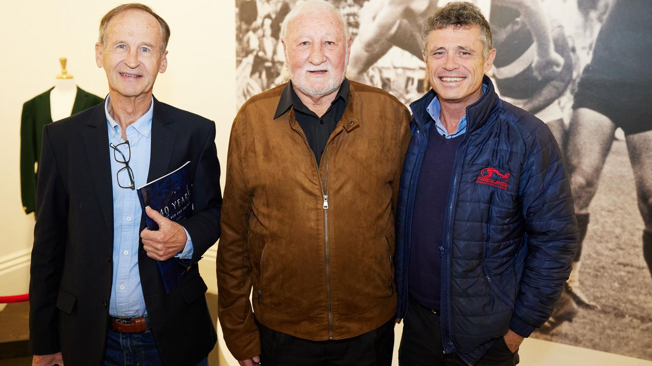 Norwood Historical Committee member Rob Crompton with club legends Graham Molloy and CEO James Fantasia at the launch of exhibition Beyond the Bleachers. Norwood footy fans have until the end of the month to soak up a fascinating display of historic memorabilia. Image: Andre Castellucci