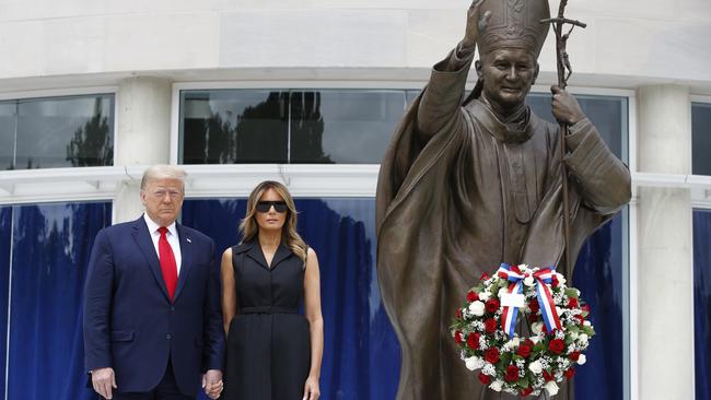 President Donald Trump and first lady Melania Trump visit Saint John Paul II National Shrine in Washington.