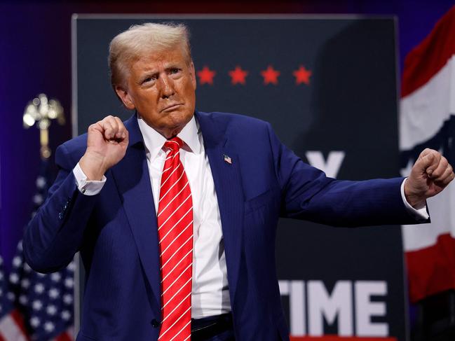 ATLANTA, GEORGIA - OCTOBER 15: Republican presidential nominee, former U.S. President Donald Trump greets supporters dances after delivering remarks during a campaign rally at the Cobb Energy Performing Arts Centre on October 15, 2024 in Atlanta, Georgia. With early voting starting today in Georgia both Trump and Democratic presidential nominee, Vice President Kamala Harris are campaigning in the Atlanta region this week as polls show a tight race.   Kevin Dietsch/Getty Images/AFP (Photo by Kevin Dietsch / GETTY IMAGES NORTH AMERICA / Getty Images via AFP)