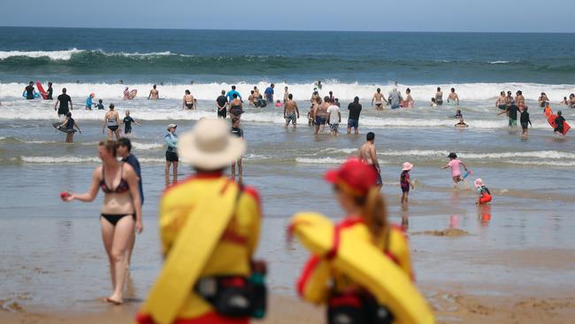 Life savers watch swimmers inside the flags at Jan Juc. Picture: Alex Coppel