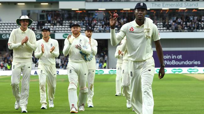 England bowler Jofra Archer leaves the field holding the ball after claiming six wickets during day one at Headingley. Picture: Getty Images