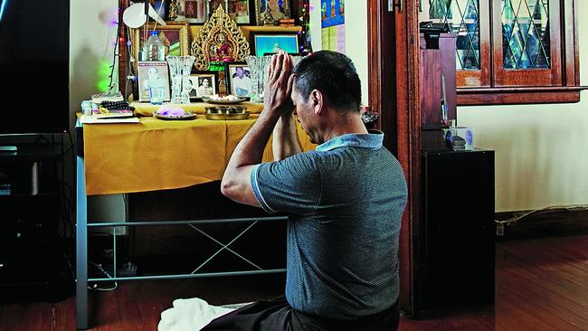 Hantun Hantun prays before his Buddhist shrine in his Sunny Avenue home. Picture: Justine Walpole