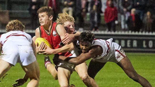 PAC’s Harry Tunkin and Kysiah Pickett tackle a Henley opponent at Norwood Oval. Picture: Matt Loxton