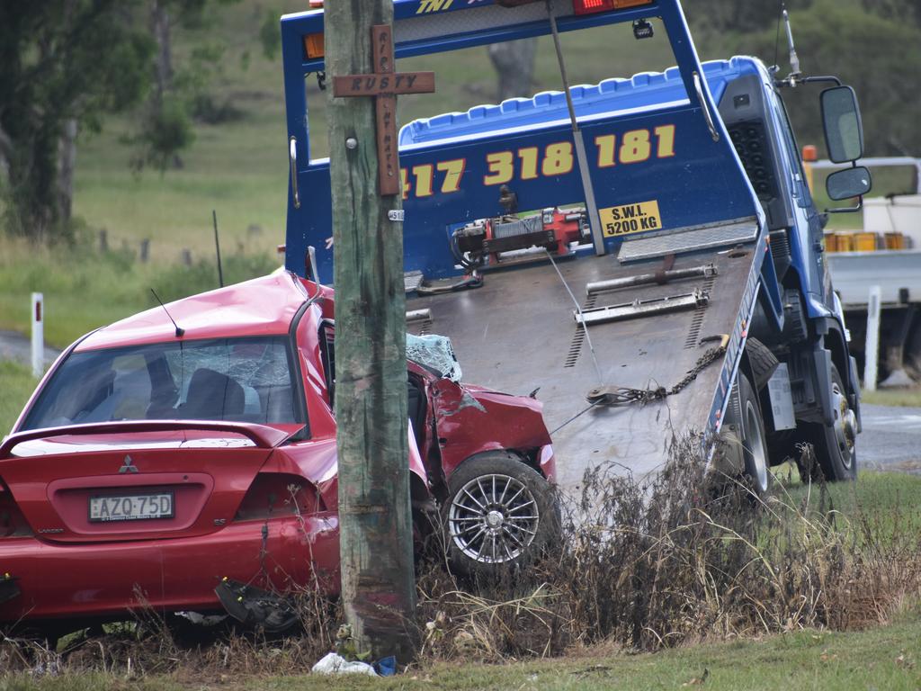 The scene of a single vehicle crash in which a red sedan Mitsubishi Lancer sedan crashed into a power pole on Rogans Bridge Rd north of Waterview Heights on Thursday, 18th February, 2021. Photo Bill North / The Daily Examiner