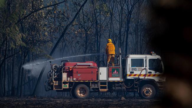 A bushfire ripped through the Livingstone area this afternoon, threatening local properties. Picture: Che Chorley