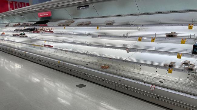 Almost empty shelves on Tuesday at the Coles North Ward after significant delays to grocery deliveries.