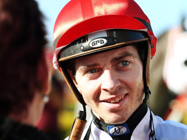 Ric McMahon after winning Race 6 on Upstart Pride at Doomben Racecourse. Pics Tara Croser.