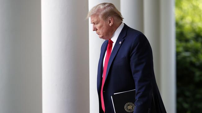 Trump arrives to speak about the coronavirus in the Rose Garden of the White House on Monday. Picture: Alex Brandon/AP