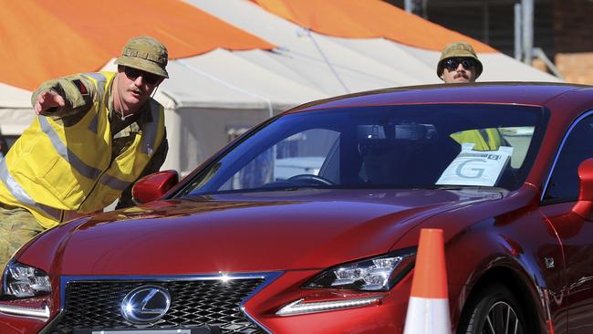 A border pass on the windscreen of a car coming through a Queensland-NSW checkpoint. Picture: Scott Powick.