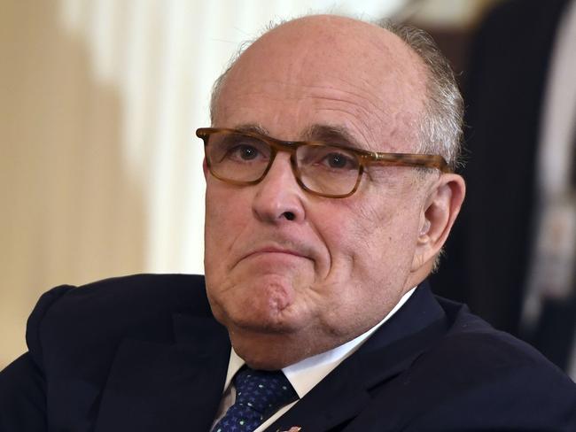 (FILES) In this file photo taken on July 9, 2018 lawyer of US president Donald Trump, Rudy Giuliani looks on before the US president announces his Supreme Court nominee in the East Room of the White House in Washington, DC. - A lawyer for Donald Trump on December 16, 2018 pushed back against reports that the special counsel investigating Russian meddling in the 2016 election might be seeking to interview the president, saying it would happen only 