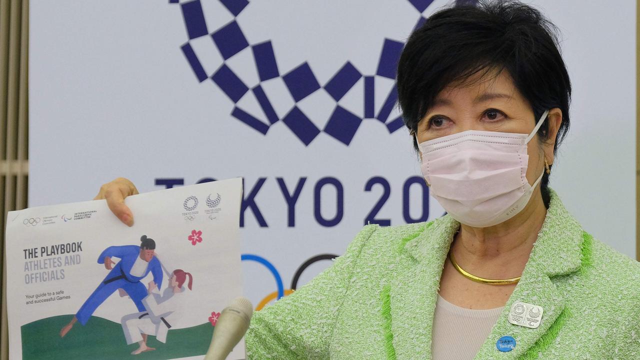 Tokyo Governor Yuriko Koike shows the Tokyo 2020 Olympics playbook.