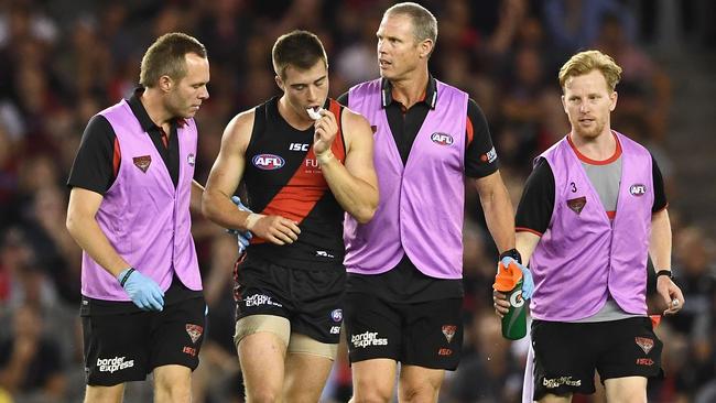 Zach Merrett is helped from the ground. Picture: Getty Images