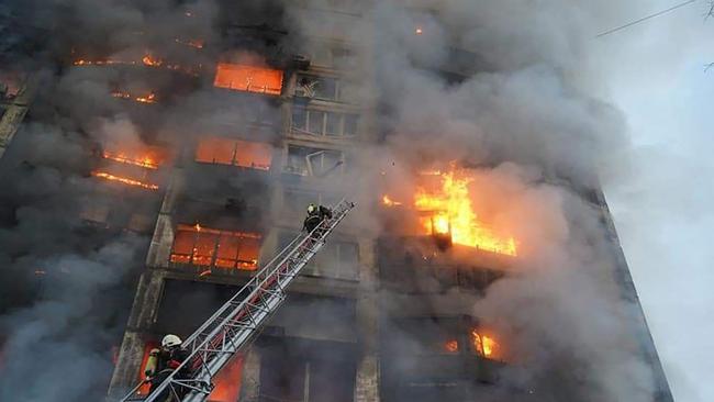 Firemen work to extinguish a fire in a housing block hit by shelling in the Sviatoshynsky district in western Kyiv. Picture: AFP