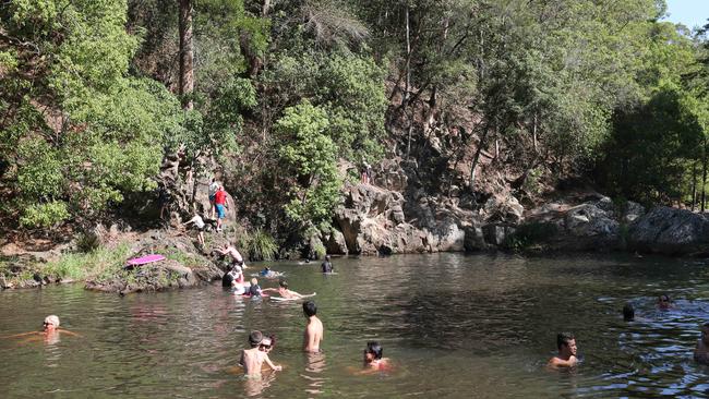 People cooling down at the Popular Currumbin rock pools. Picture Mike Batterham