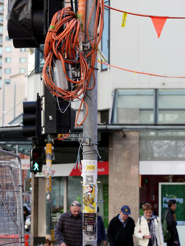 Temporary wires hanging on a traffic light near where the incident happened. Picture: Jonathan Ng