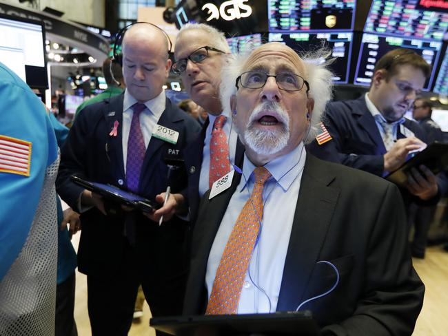 Trader Peter Tuchman works on the floor of the New York Stock Exchange.