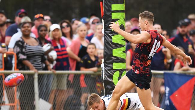 Attendees to this weekends Traegar Park AFL match in Alice Springs have been encouraged to “rug up” and bring along a rain jacket. Pictured: Round 10 AFL match between the Melbourne Demons and the Adelaide Crows at Traegar Park Oval in Alice Springs in 2018. (AAP Image/Mark Brake)