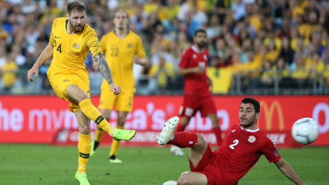 Australia’s Martin Boyle, left, scores against Lebanon in a friendly in Sydney last November. Picture: AFP