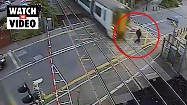 Terrifying moment man almost hit by train