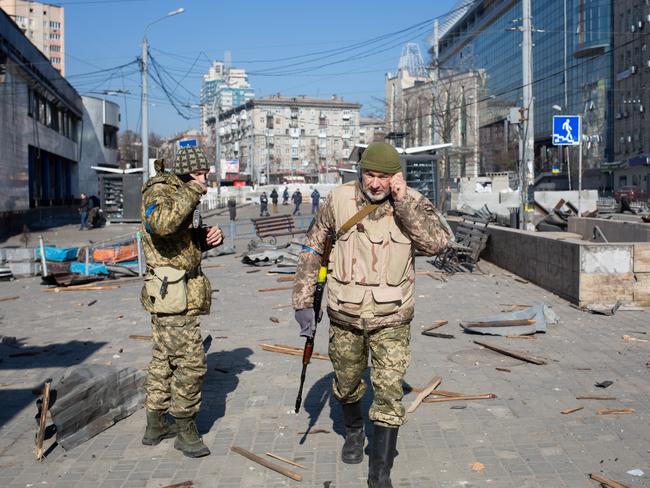 Ukrainian servicemen by building which got shelled near Lukyanivska metro station on March 14, 2022 in Kyiv, Ukraine. Picture: Getty Images